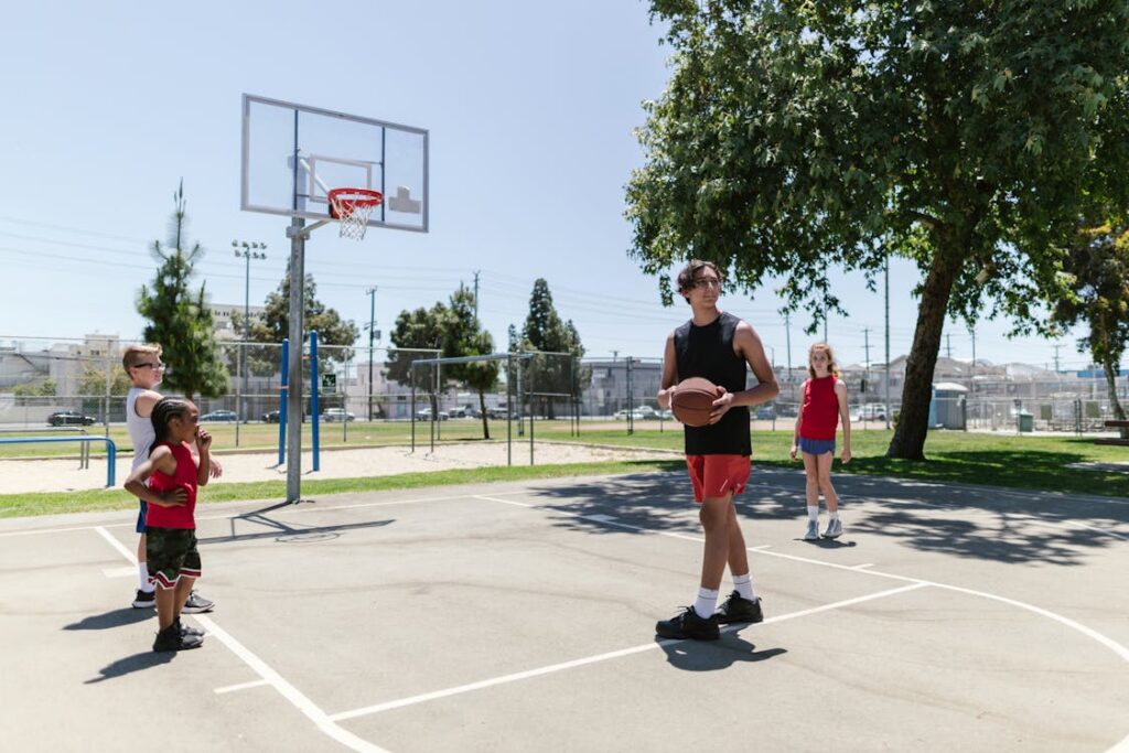 Basketball coach instructing team during practice session